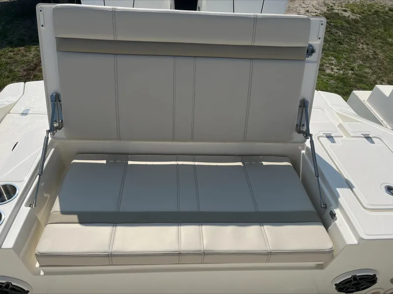 Slide: The Image of 2023 Boston Whaler 280 Dauntless boat seat with beige upholstery and foldable backrest. - 4