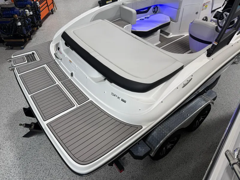 Slide: The Image of 2023 Sea Ray SPX 190 boat with spacious deck and modern interior lighting. - 10