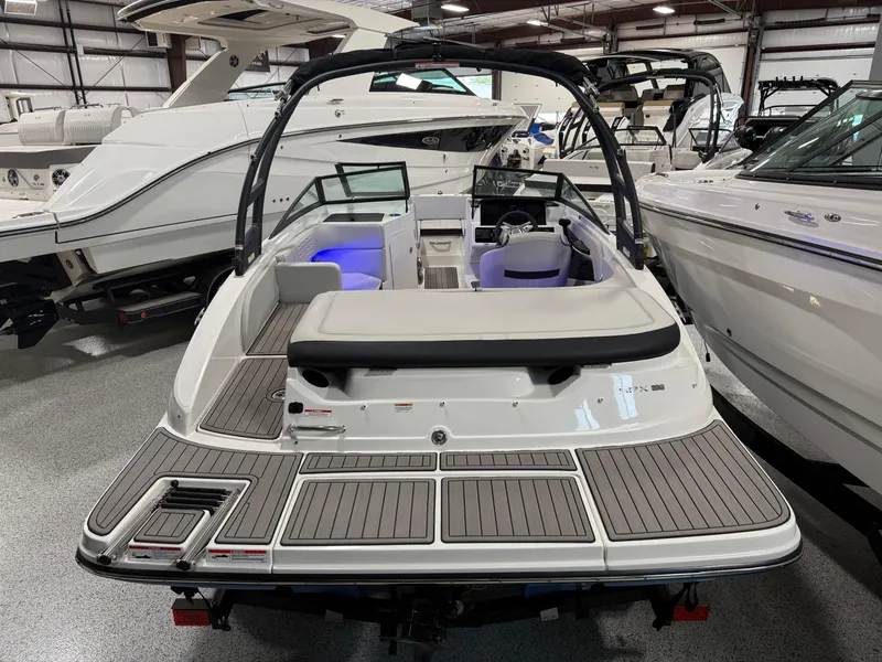 Slide: The Image of 2023 Sea Ray SPX 190 boat in showroom, rear view with open cockpit and seating. - 11