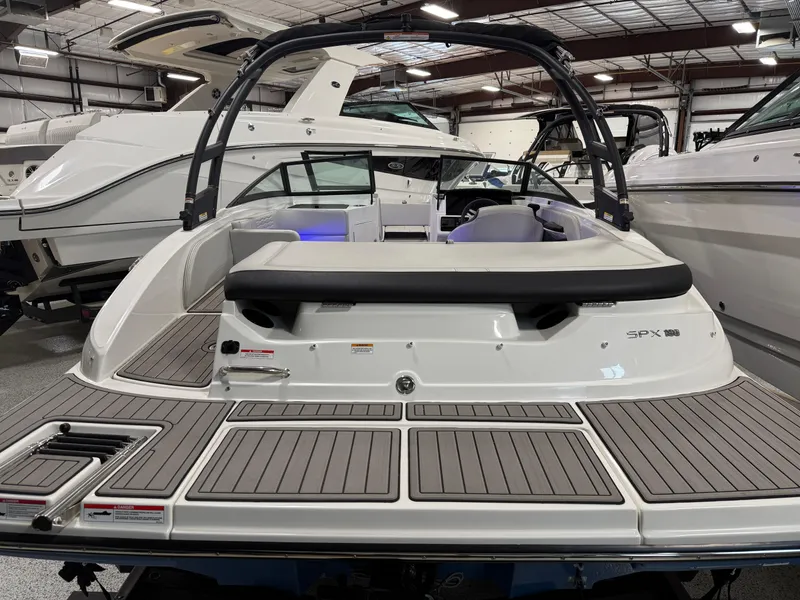 Slide: The Image of 2023 Sea Ray SPX 190 boat in showroom, rear view with swim platform. - 12