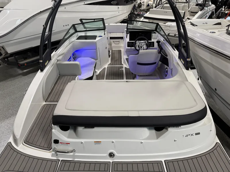 Slide: The Image of 2023 Sea Ray SPX 190 boat interior with modern seating and ambient lighting. - 13