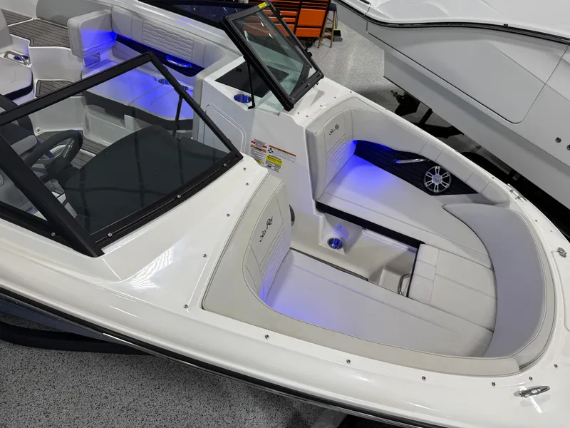 Slide: The Image of 2023 Sea Ray SPX 190 boat interior with blue LED lighting. - 20
