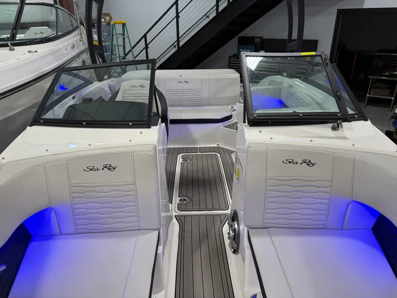 Slide: The Image of 2023 Sea Ray SPX 190 boat interior with blue LED lighting and sleek design. - 27