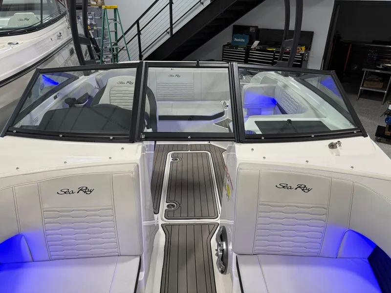 Slide: The Image of 2023 Sea Ray SPX 190 boat interior with blue LED lighting and sleek design. - 28