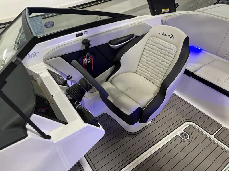 Slide: The Image of 2023 Sea Ray SPX 190 boat interior with captain's seat and steering wheel. - 30