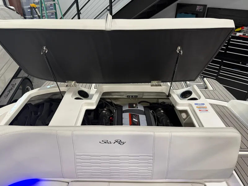 Slide: The Image of 2023 Sea Ray SPX 190 boat engine compartment with open hatch. - 33