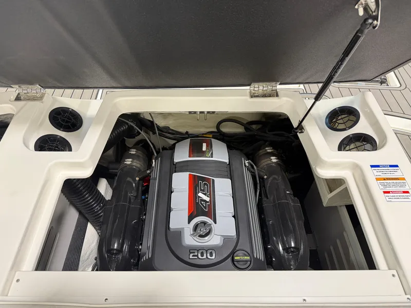 Slide: The Image of Engine compartment of 2023 Sea Ray SPX 190 boat, featuring a powerful 4.5L 200 HP engine. - 34