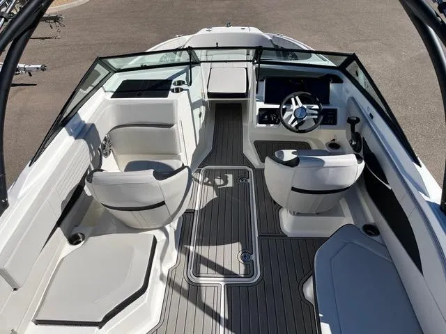 Slide: The Image of 2023 Sea Ray SPX 190 boat interior with modern seating and steering wheel. - 41