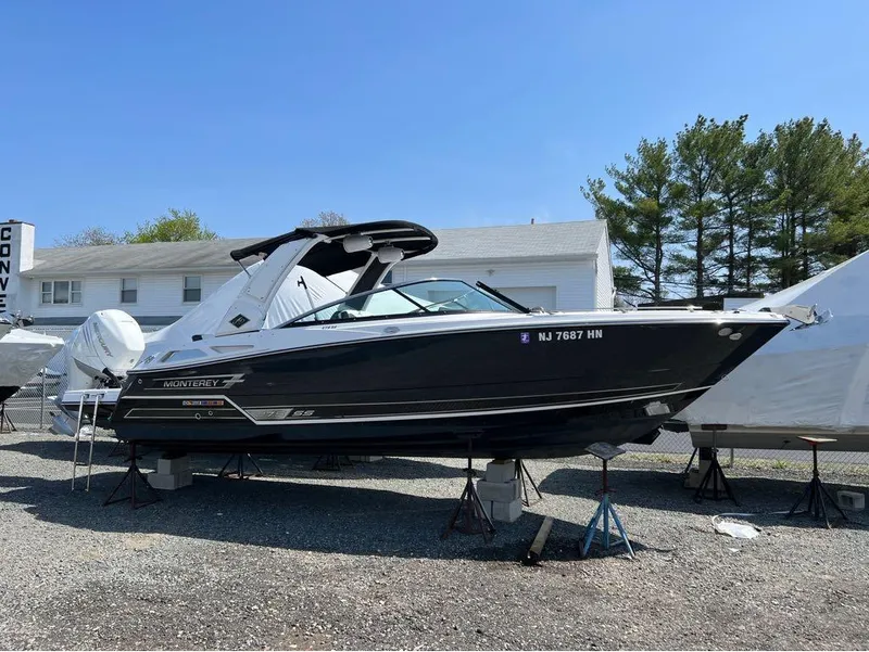 Slide: The Image of 2020 Monterey 275 Super Sport boat on stands, outdoor display. - 13