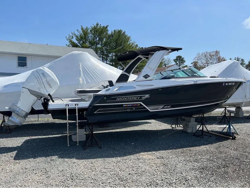 Slide: The Image of 2020 Monterey 275 Super Sport boat on stands, outdoor storage. - 16