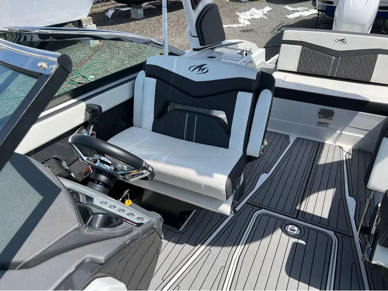 Slide: The Image of Interior of 2020 Monterey 275 Super Sport boat with sleek seating and modern controls. - 19