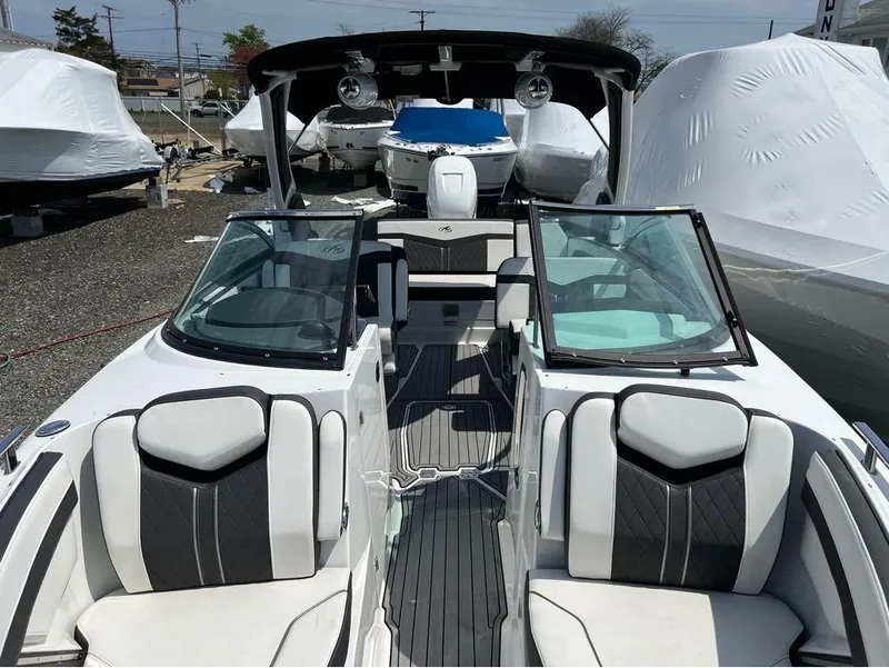 Slide: The Image of 2020 Monterey 275 Super Sport boat with sleek interior design and open cockpit. - 20