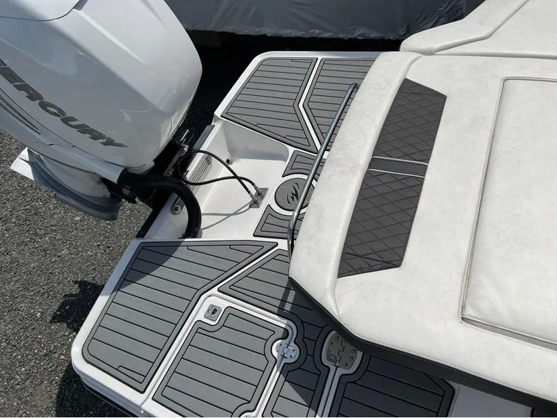 Slide: The Image of 2020 Monterey 275 Super Sport boat with Mercury engine and sleek deck design. - 5