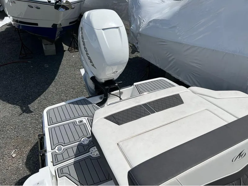 Slide: The Image of 2020 Monterey 275 Super Sport boat with Mercury outboard engine, docked and covered. - 6