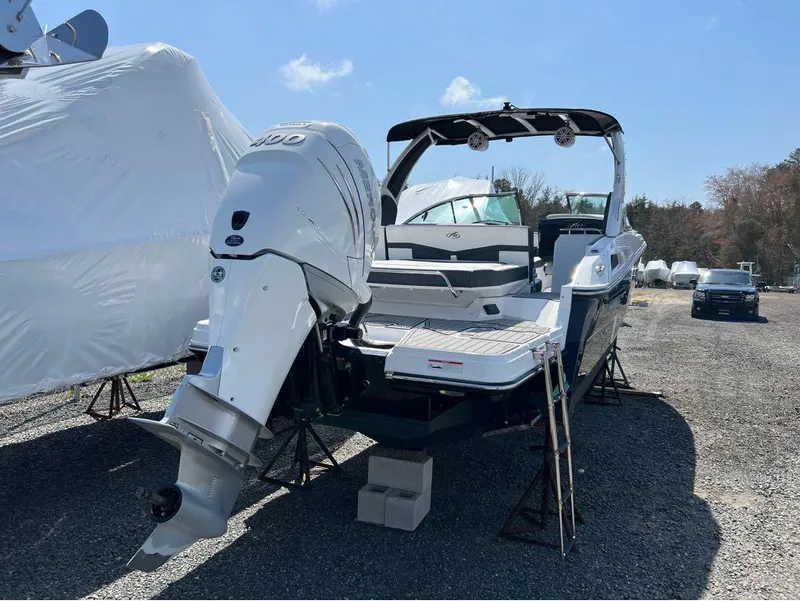 Slide: The Image of 2020 Monterey 275 Super Sport boat with powerful outboard motor in storage yard. - 7