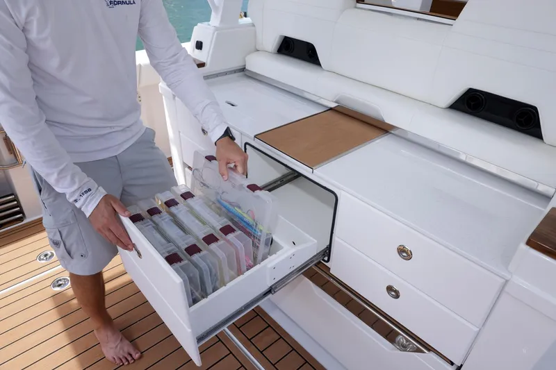 Slide: The Image of 2023 Formula 387 Center Console Fish with organized tackle storage drawer. - 11