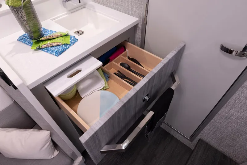 Slide: The Image of 2023 Formula 387 Center Console Fish boat interior with open drawer and sink. - 27