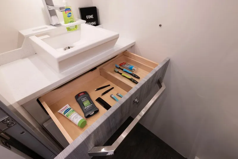 Slide: The Image of Open drawer with toiletries in 2023 Formula 387 Center Console Fish boat bathroom. - 29