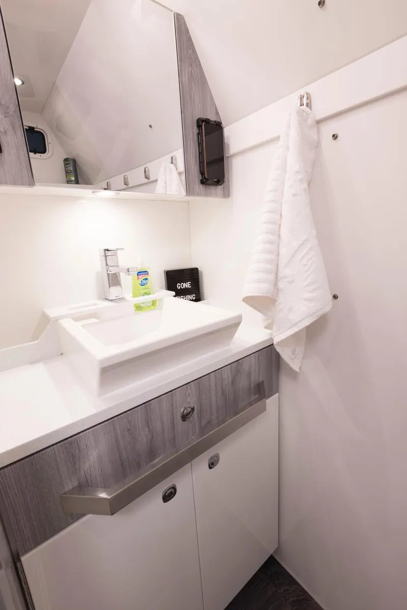 Slide: The Image of 2023 Formula 387 Center Console Fish bathroom with modern sink and mirror. - 31