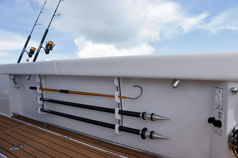 Slide: The Image of 2023 Formula 387 Center Console Fish boat with fishing rods and gaffs on deck. - 5