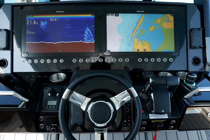 Slide: The Image of 2023 Formula 387 Center Console Sport dashboard with navigation and sonar displays. - 6