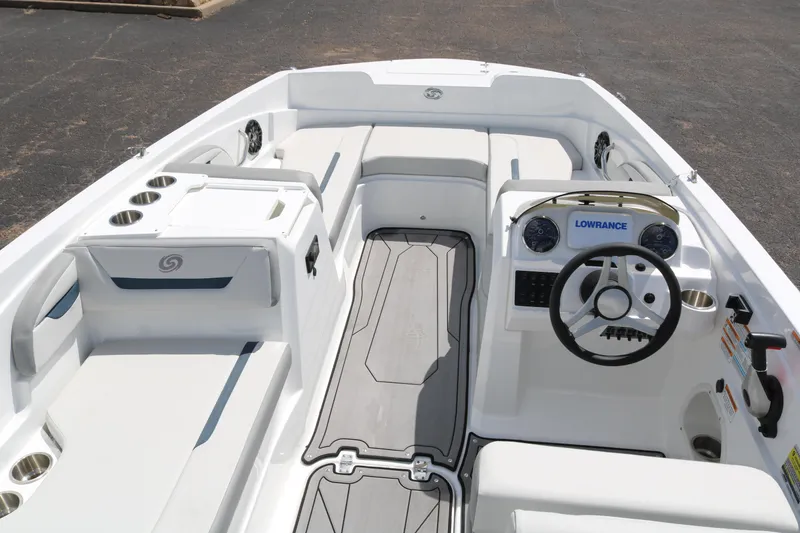 Slide: The Image of 2023 Hurricane SUN DECK 205 OB boat interior with steering wheel and seating. - 10
