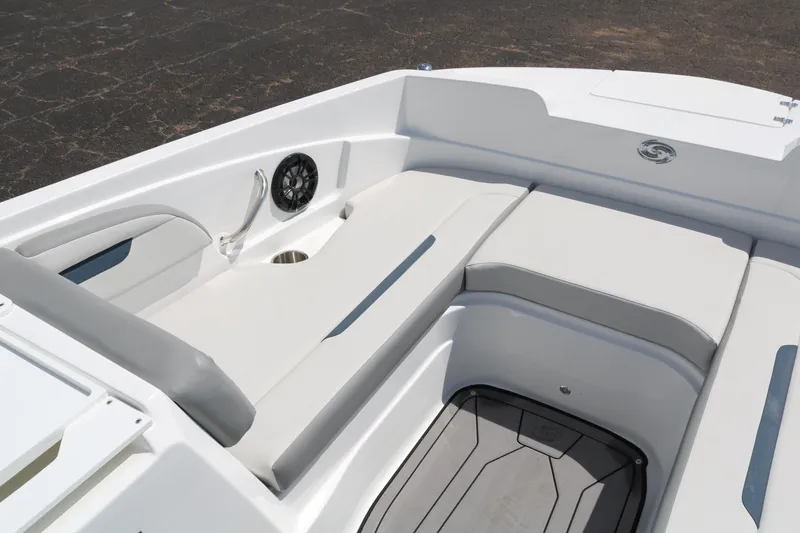 Slide: The Image of 2023 Hurricane SUN DECK 205 OB boat interior with cushioned seating and speaker. - 12