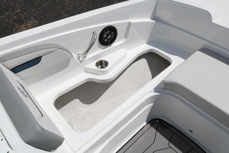 Slide: The Image of 2023 Hurricane SUN DECK 205 OB boat interior seating and storage area. - 13