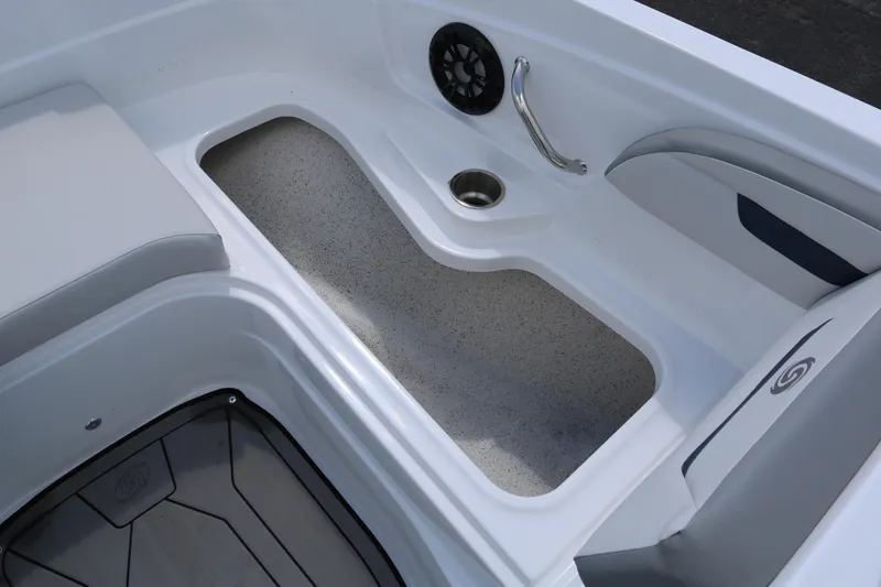 Slide: The Image of 2023 Hurricane SUN DECK 205 OB boat interior with seating and storage compartments. - 15