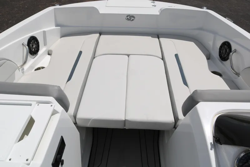 Slide: The Image of 2023 Hurricane SUN DECK 205 OB boat interior with cushioned seating. - 19