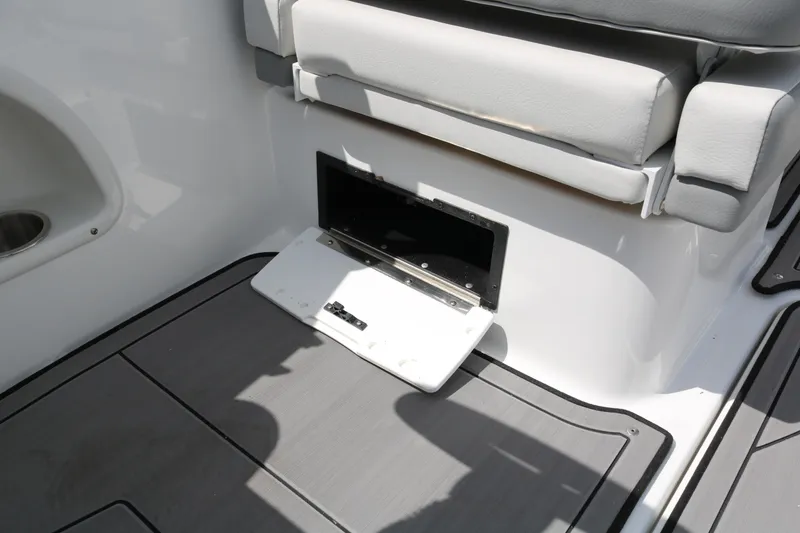 Slide: The Image of 2023 Hurricane SUN DECK 205 OB boat storage compartment with open hatch. - 26