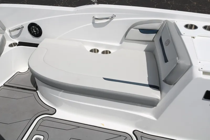 Slide: The Image of 2023 Hurricane SUN DECK 205 OB boat seating area with cup holders and speaker. - 27