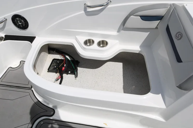 Slide: The Image of 2023 Hurricane SUN DECK 205 OB boat storage compartment with cup holders and wiring. - 28