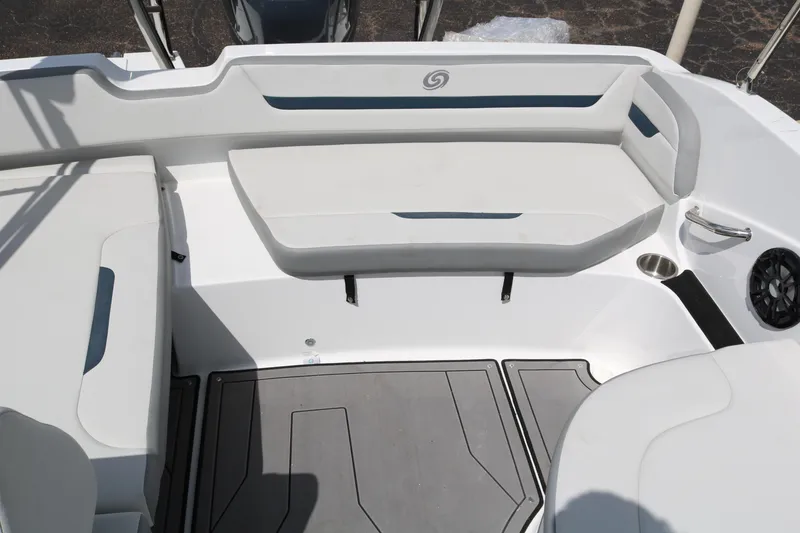 Slide: The Image of 2023 Hurricane SUN DECK 205 OB boat interior with white seating and gray flooring. - 29