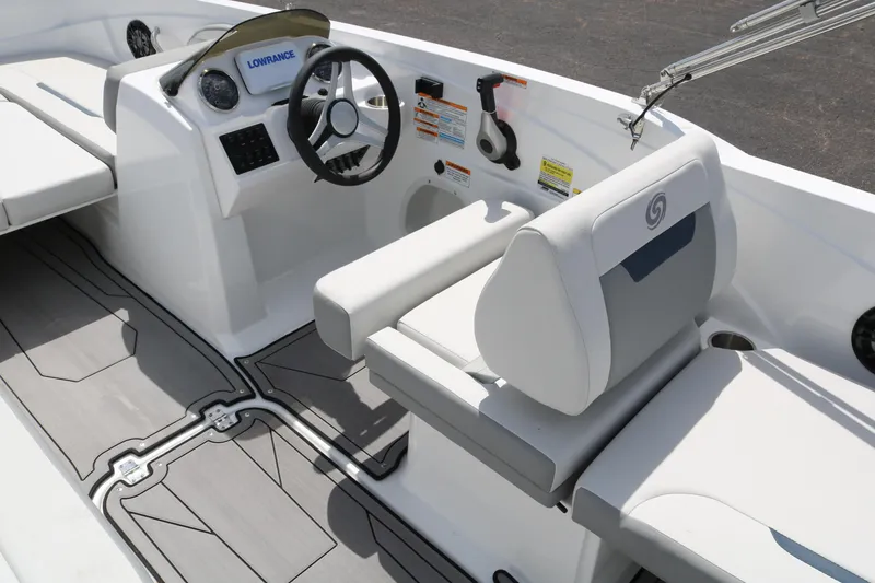 Slide: The Image of 2023 Hurricane SUN DECK 205 OB boat interior with steering wheel and seating. - 33