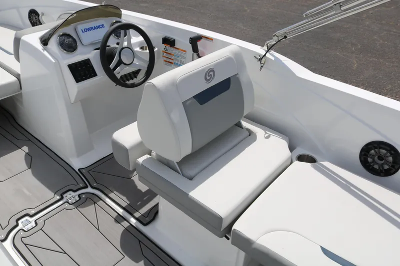 Slide: The Image of 2023 Hurricane SUN DECK 205 OB boat interior with steering wheel and seating. - 34
