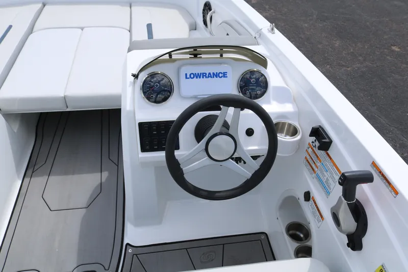 Slide: The Image of 2023 Hurricane SUN DECK 205 OB boat cockpit with steering wheel and Lowrance display. - 35