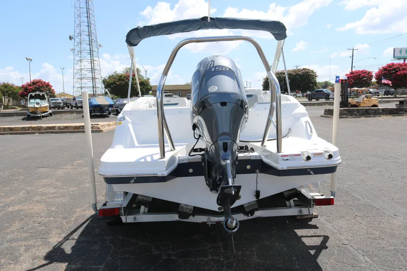 Slide: The Image of 2023 Hurricane SUN DECK 205 OB boat rear view with outboard motor. - 7