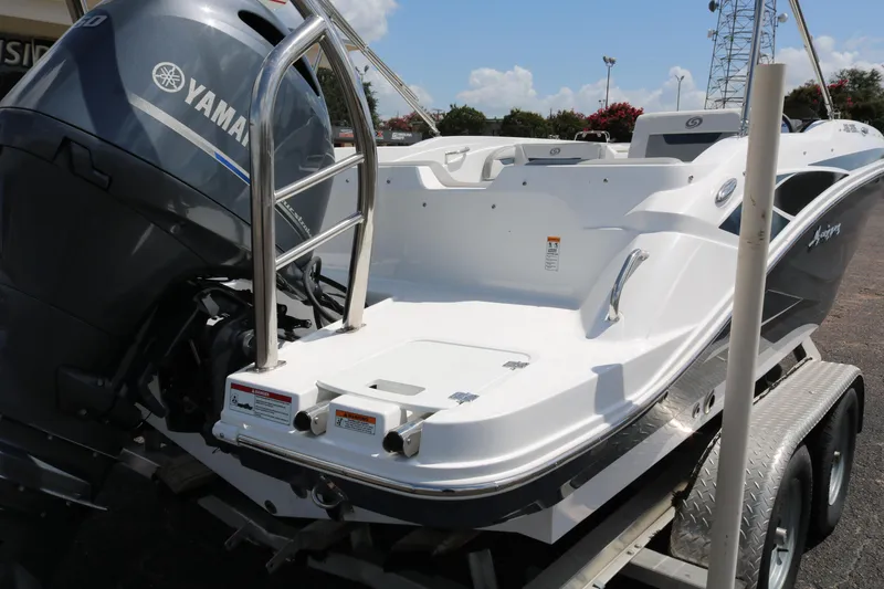Slide: The Image of 2023 Hurricane SUN DECK 205 OB boat with Yamaha outboard motor on trailer. - 8