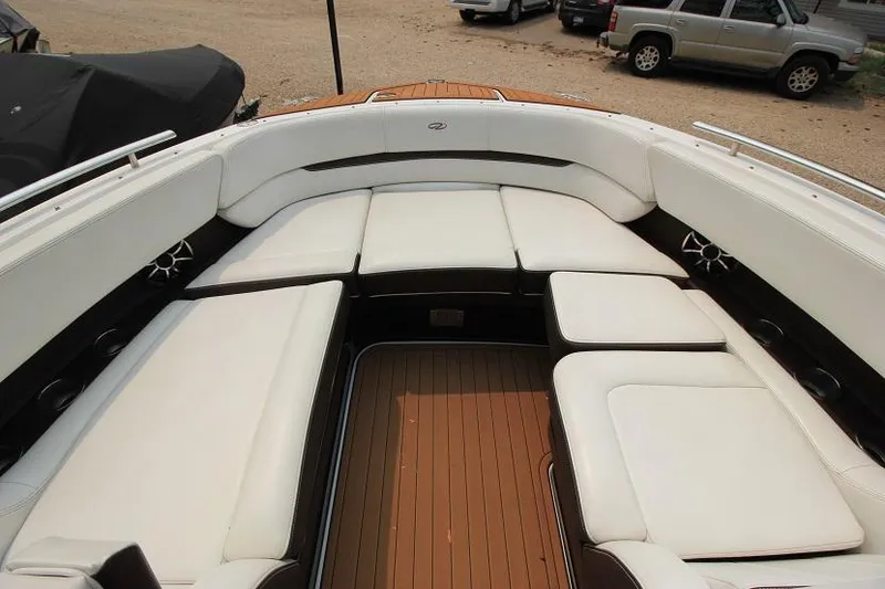 Slide: The Image of The image shows the spacious cockpit of a 2016 Regal 2800 Bowrider with white upholstery. - 20