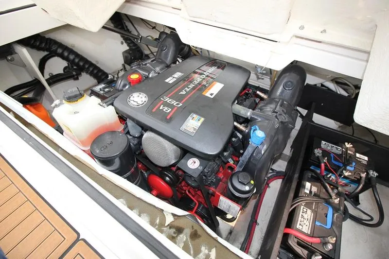 Slide: The Image of The engine compartment of a 2016 Regal 2800 Bowrider features a V8 engine and batteries. - 26