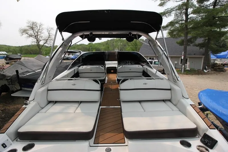 Slide: The Image of The image shows a 2016 Regal 2800 Bowrider with spacious seating areas and a sleek design. - 5