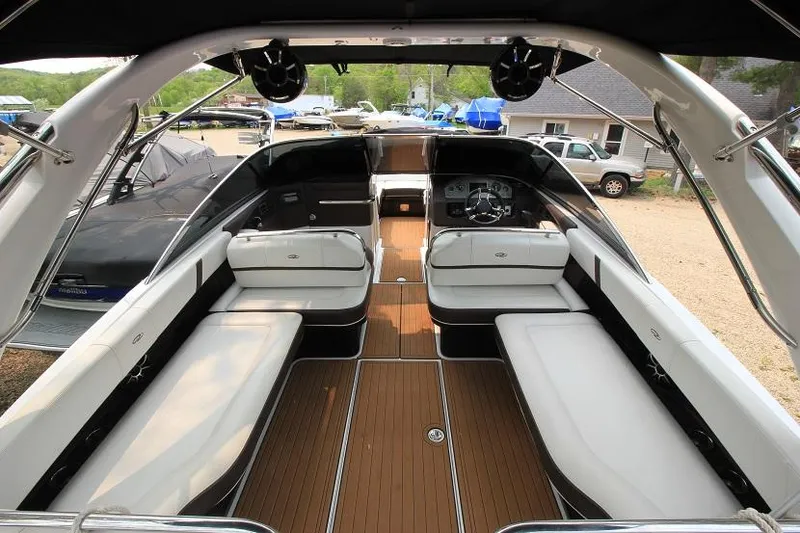 Slide: The Image of The image shows the interior of a 2016 Regal 2800 Bowrider with sleek seating and wood flooring. - 7