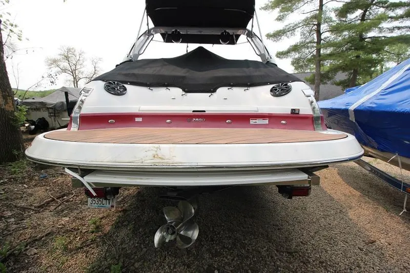 Slide: The Image of The image shows the stern of a 2016 Regal 2800 Bowrider with a large swim platform. - 4