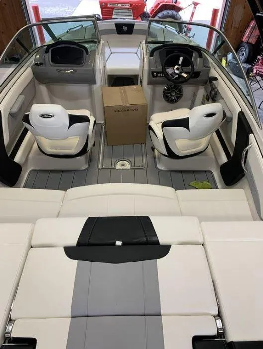 Slide: The Image of 2023 Chaparral 21 Surf boat interior with modern seating and dashboard. - 2