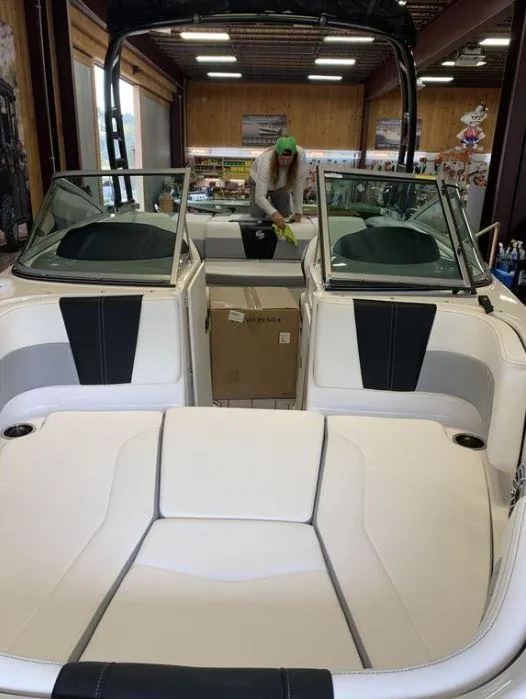 Slide: The Image of 2023 Chaparral 21 Surf boat interior with sleek seating and modern design. - 4