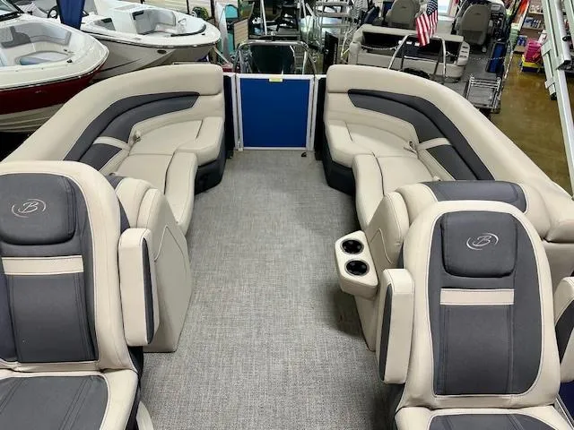 Slide: The Image of 2023 Barletta Cabrio 22QC pontoon boat interior with plush seating and cup holders. - 5
