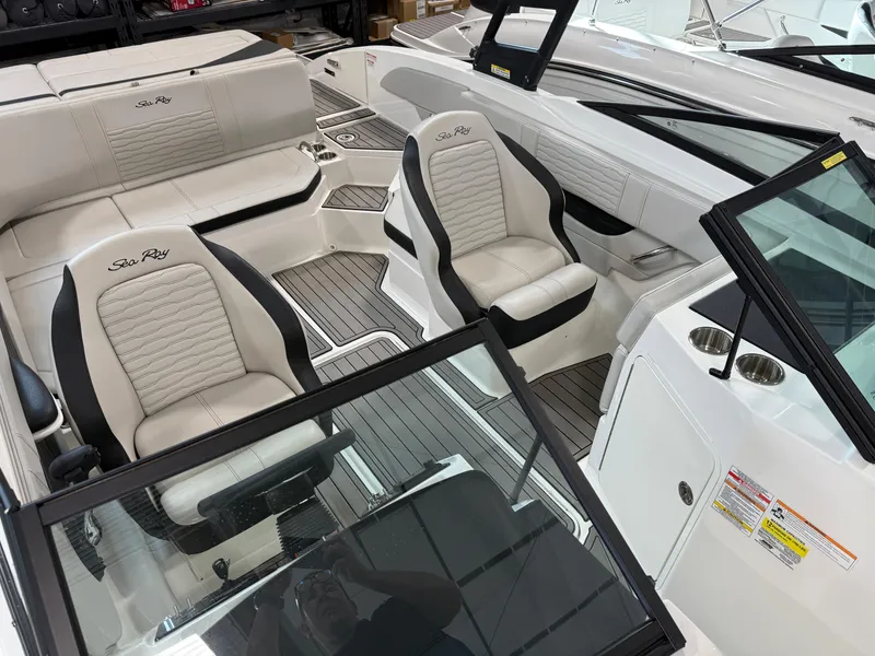 Slide: The Image of 2023 Sea Ray SPX 210 boat interior with sleek seating and modern design. - 20
