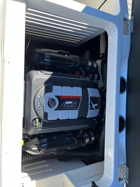 Slide: The Image of 2023 Sea Ray SPX 210 boat engine compartment with 4.5L 250 horsepower engine. - 27