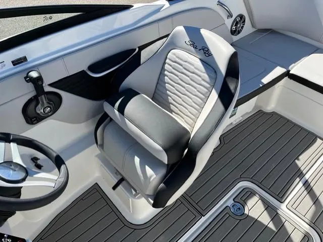 Slide: The Image of 2023 Sea Ray SPX 210 boat interior with sleek seating and modern design. - 29